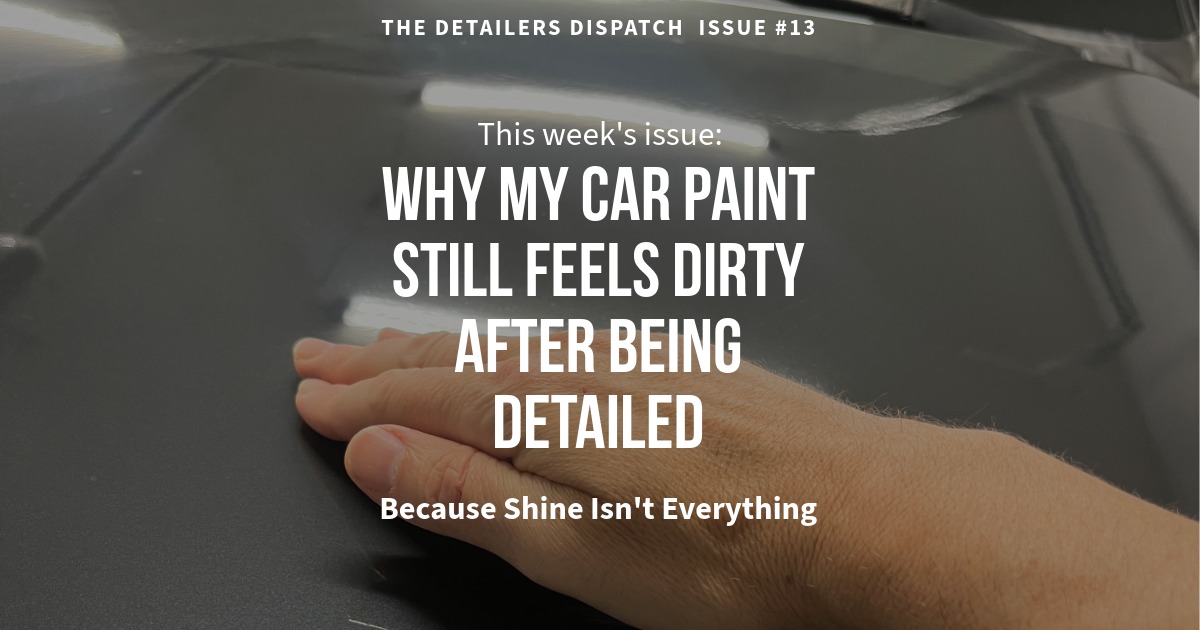 hand running along gray car paint